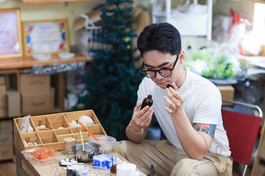 Hieu Binh in his candle shop