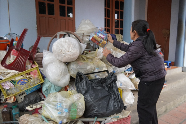 Ms. Luyen arranging the recyclables