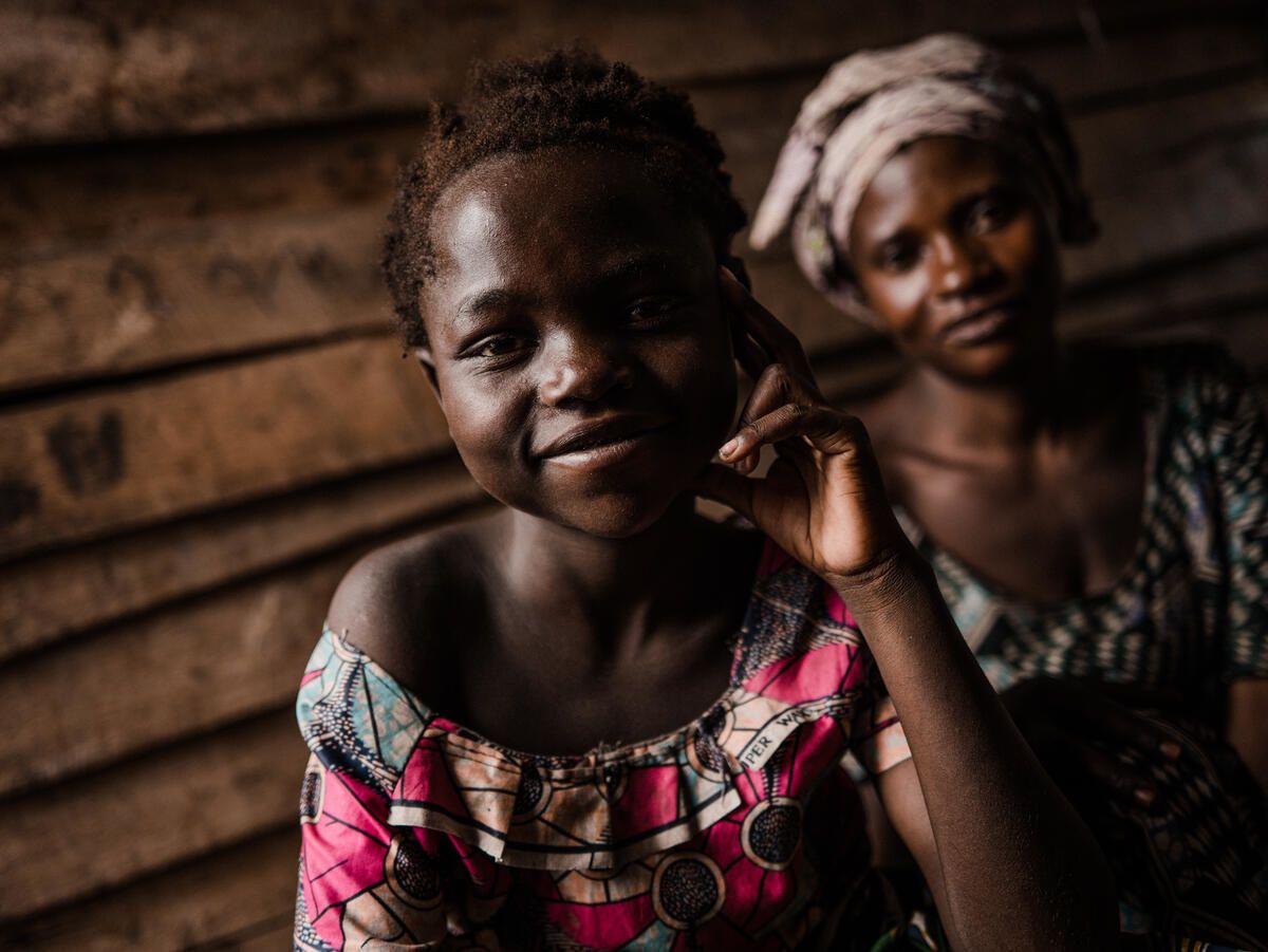 Liliane*, 13 and her mother Jeanine*, 35, in their home.