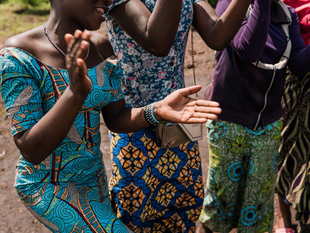 Girls dance during an activity at the Child Friendly space.