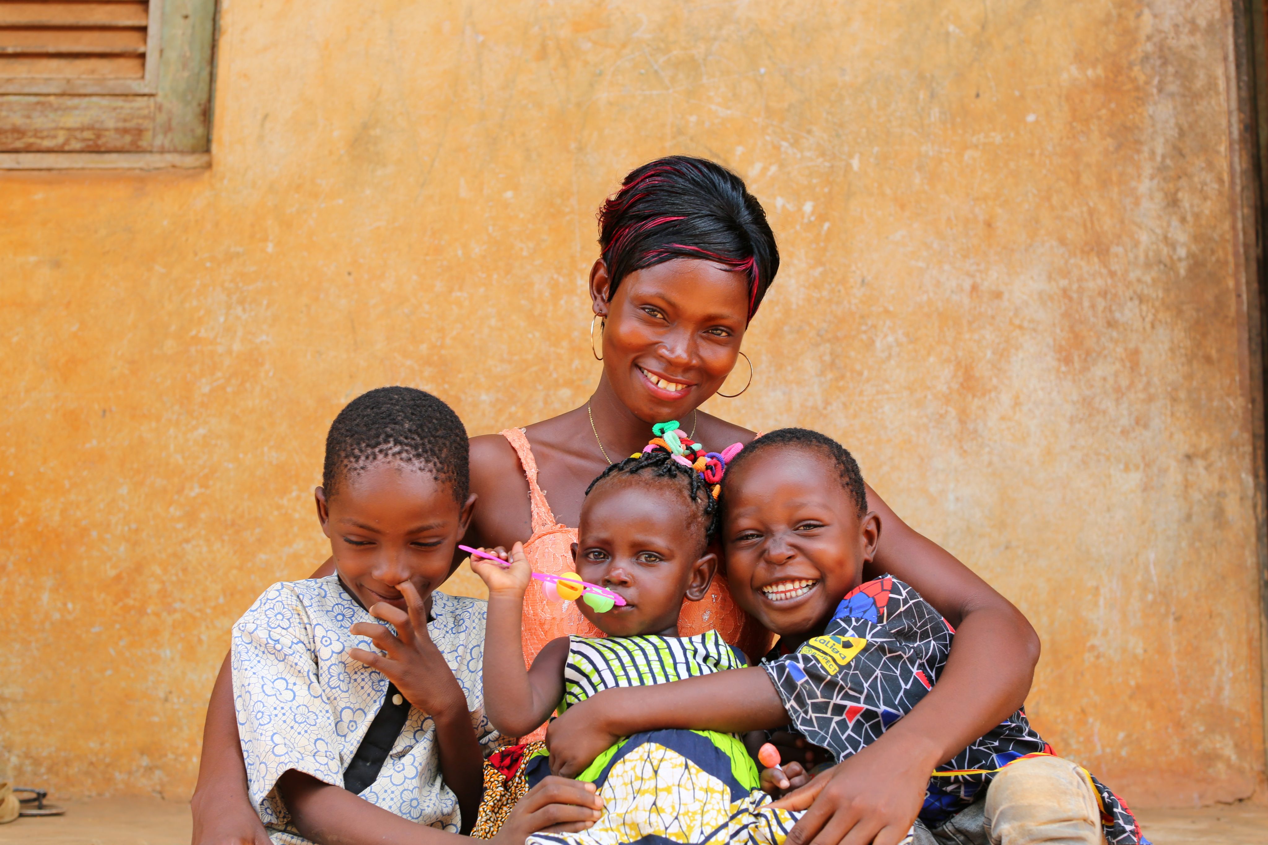 Prisca(28) and her children Martin(8), Blaise(4), and Charlene(1).