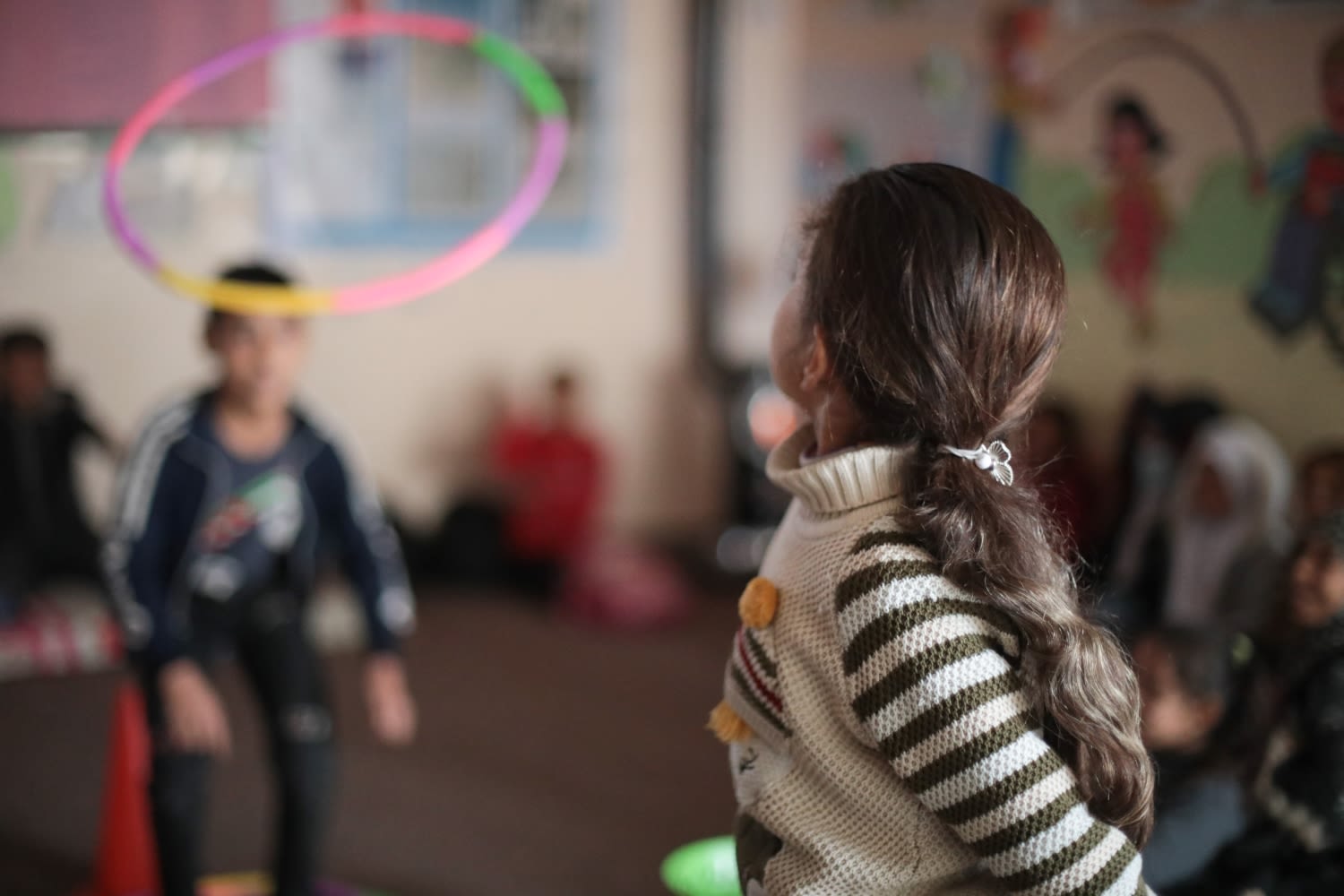 Nerjis* plays games at the Save the Children Child Friendly Space. Photo: Shiyar Omar / Save the Children.
