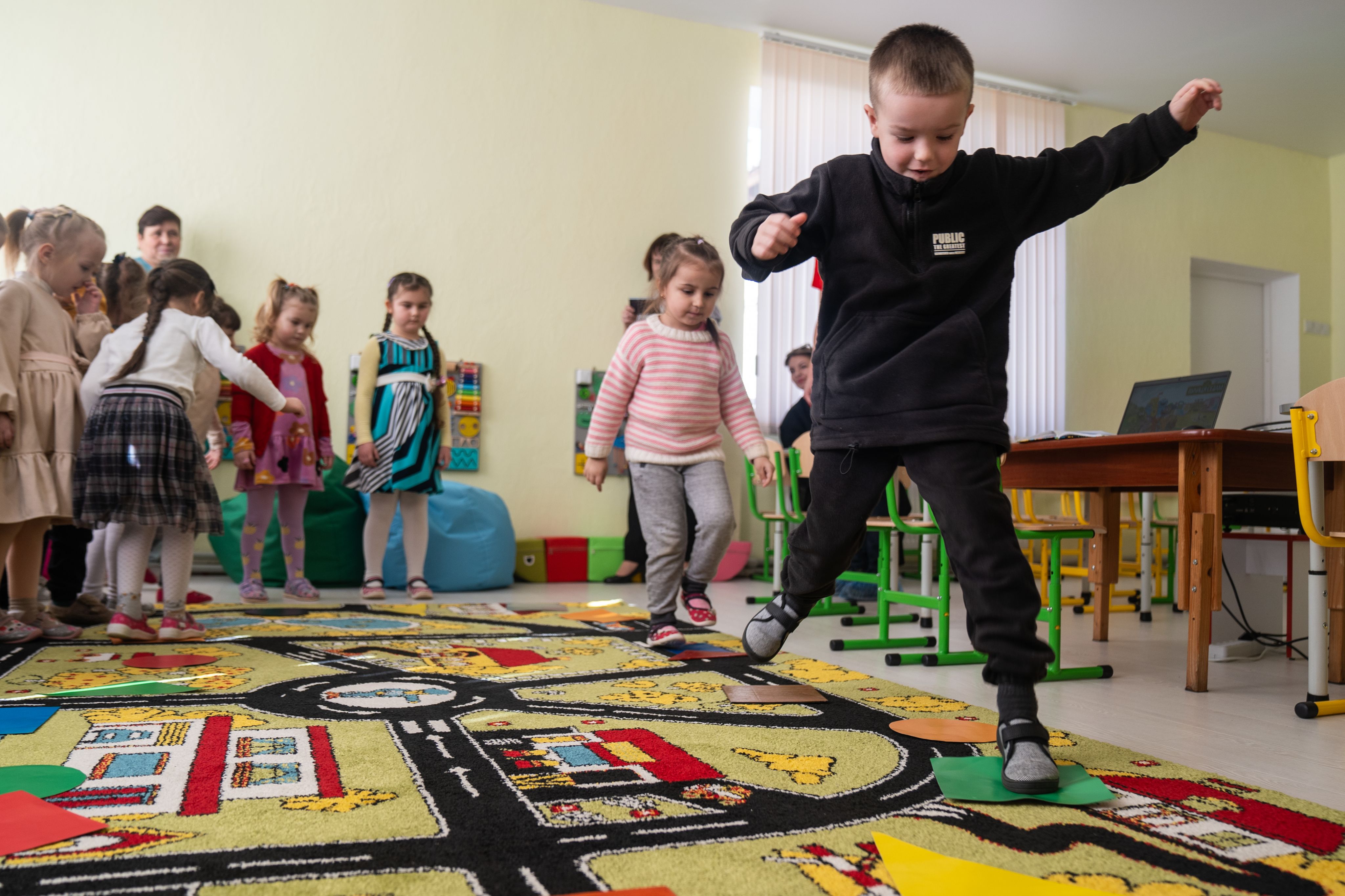 Kindergarten children play and learn at a Child-Friendly Space in Ukraine. 