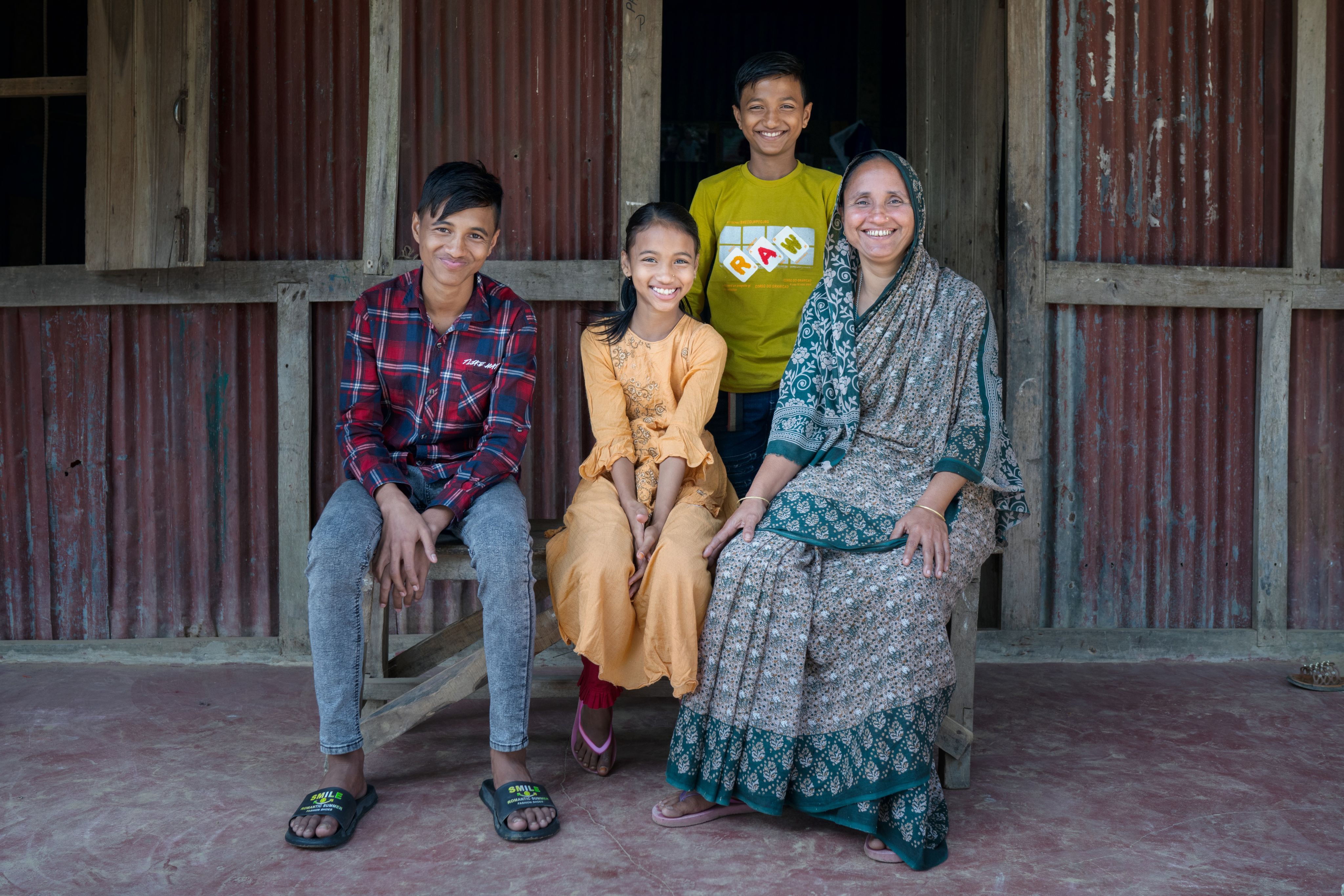 Ruly Begum with her children Afsa, 9, Sururdhy, 11 and Pabel, 14, in Sylhet, Bangladesh. Fabeha Monir/Save The Children