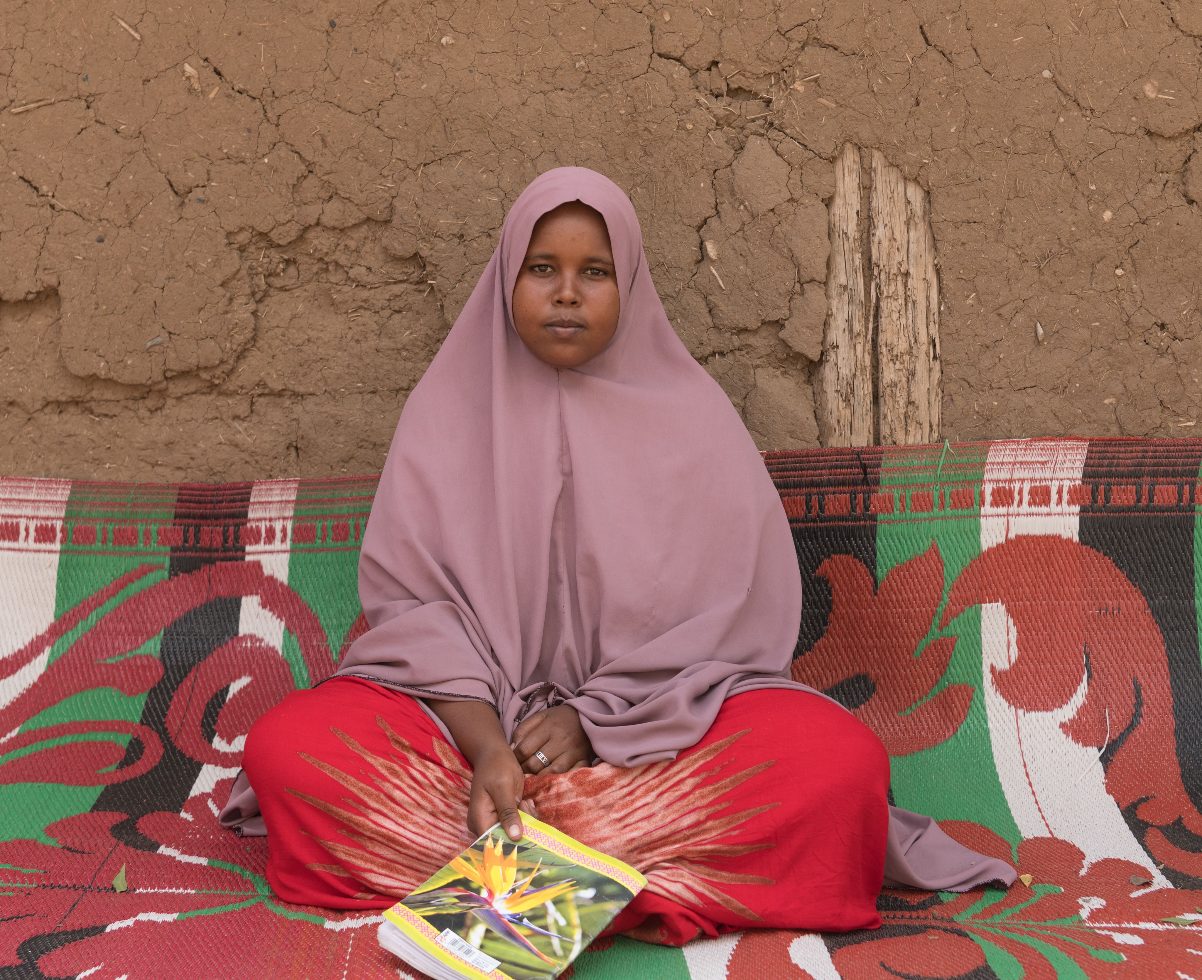 Saeda*, 16, sits in her family home in the Somali region, Ethiopia. 