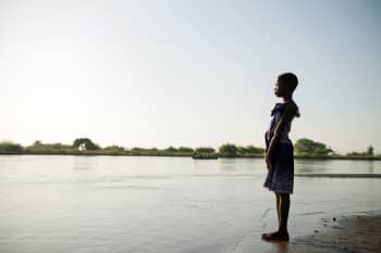 Sarah, 11, looking out over the Shira RIver that flooded her home, Malawi