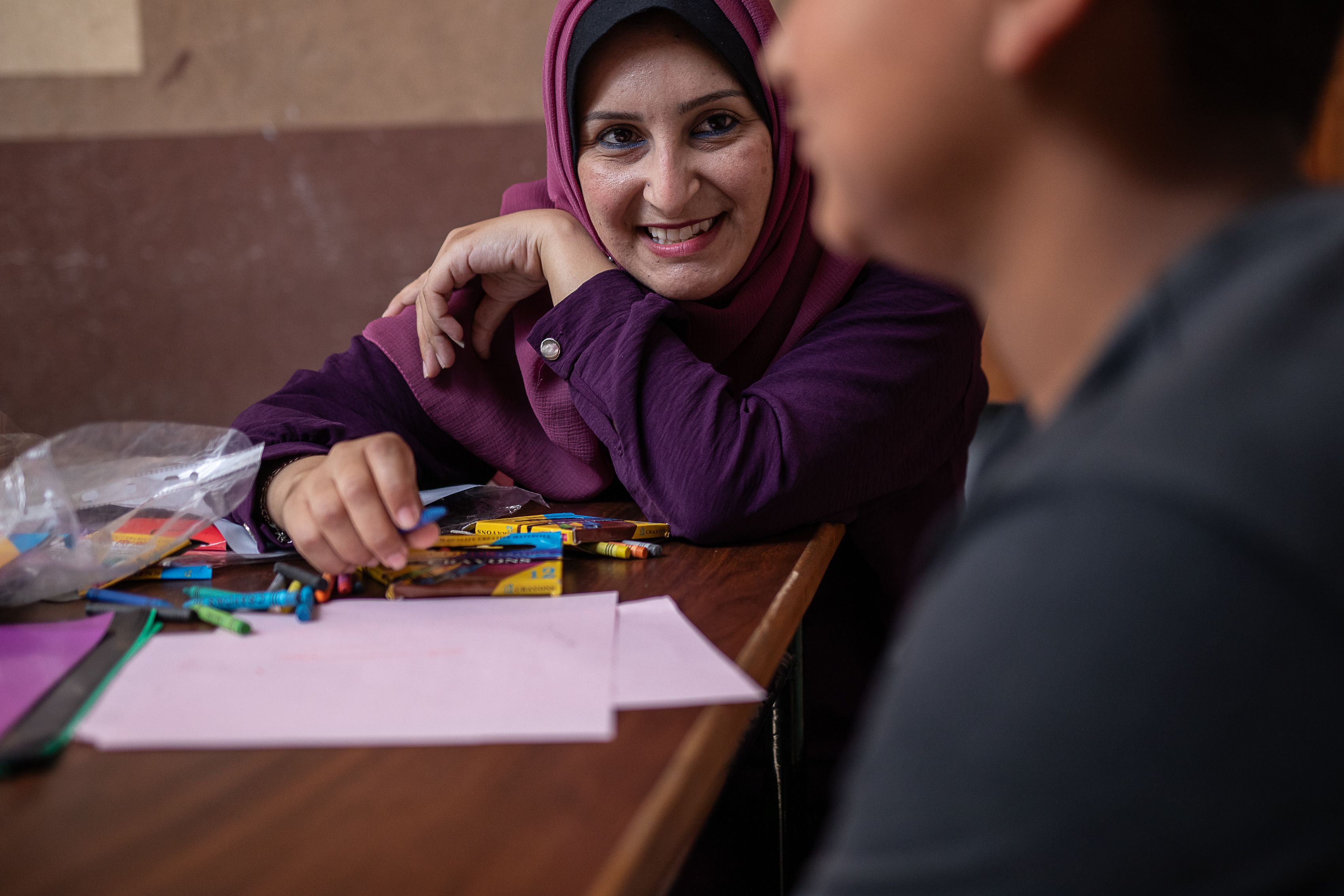Saleem* (14) with his case worker Maha* in Gaza