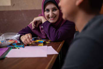 Saleem* (14) with his case worker Maha* in Gaza