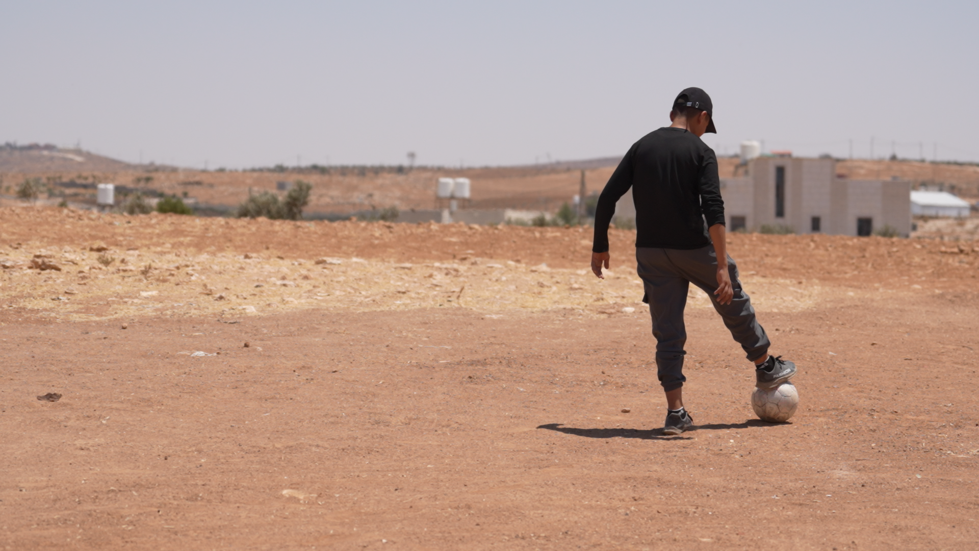 Kareem*, 16, plays football in his hometown in the West Bank.