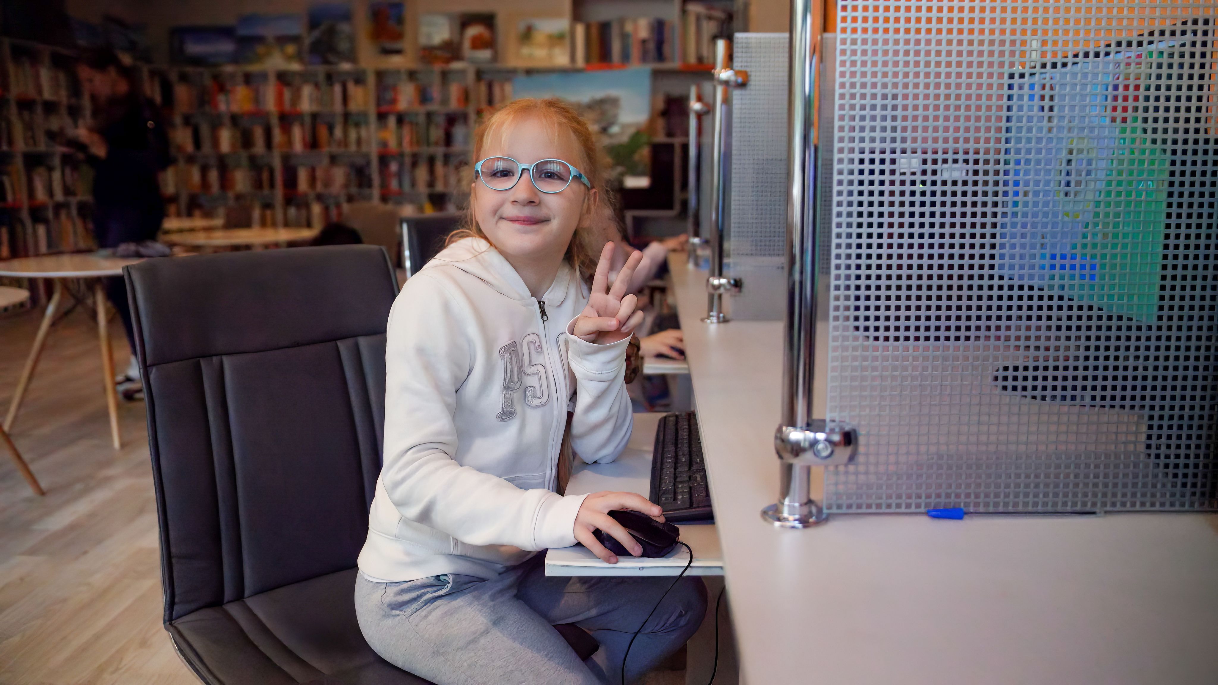 Anzhela*, 8, plays with a computer in a Digital Learning Center in Lodz