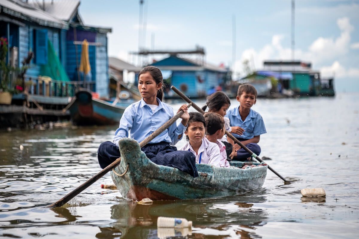  Ratana, 12, travelling to school by boat with some of her schoolmates on Tonle Sap Lake, Cambodia.