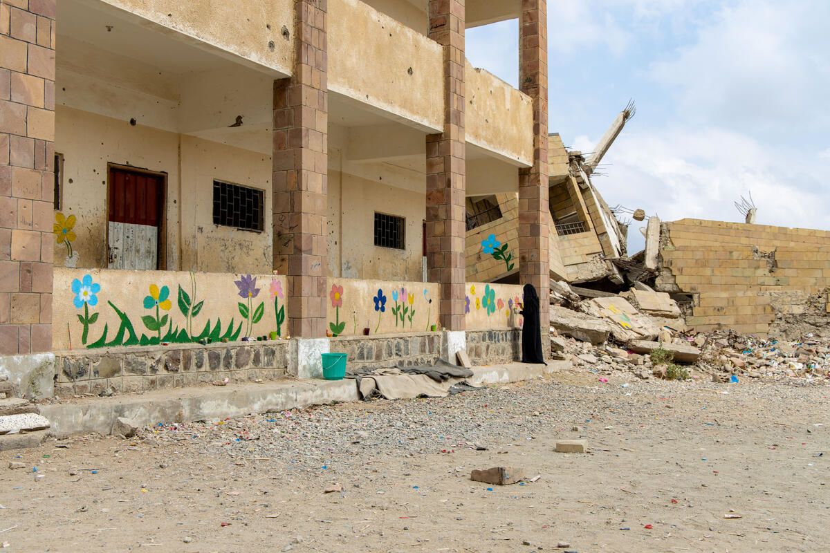 A flower mural painted by children on the walls of a destroyed school in Yemen.
