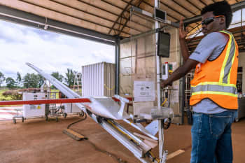A drone packed with medical supplies and blood takes off at Zipline in Kayonza, Rwanda.