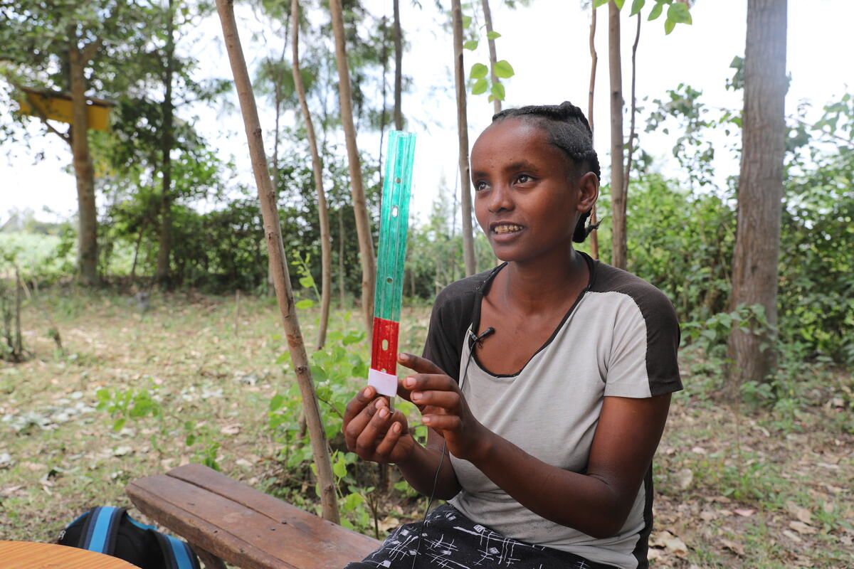 Mother Haymanot* gives feedback on a prototype tool for measuring newborn foot length.