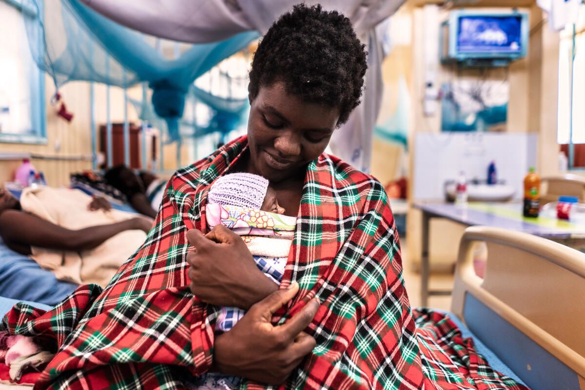 Rezian, 19, holding her newborn baby in the Kangaroo Mother Care ward at a hospital in Bungoma, Kenya. 