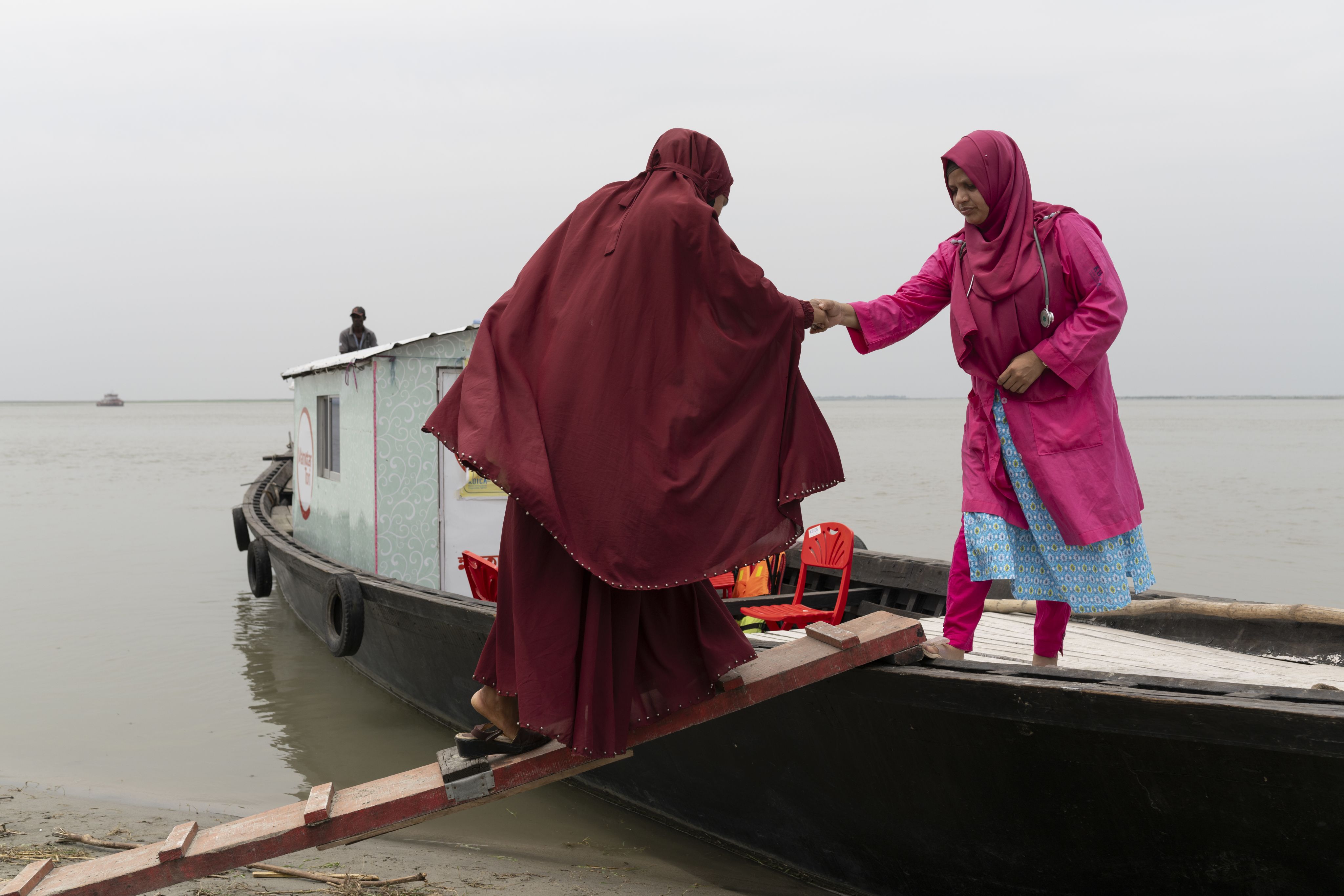5-months pregnant Tisha* attends a check-up with Nargis, a midwife at a satellite clinic run by Save the Children's Mamota project to support Char communities in Gaibandha, Bangladesh.
