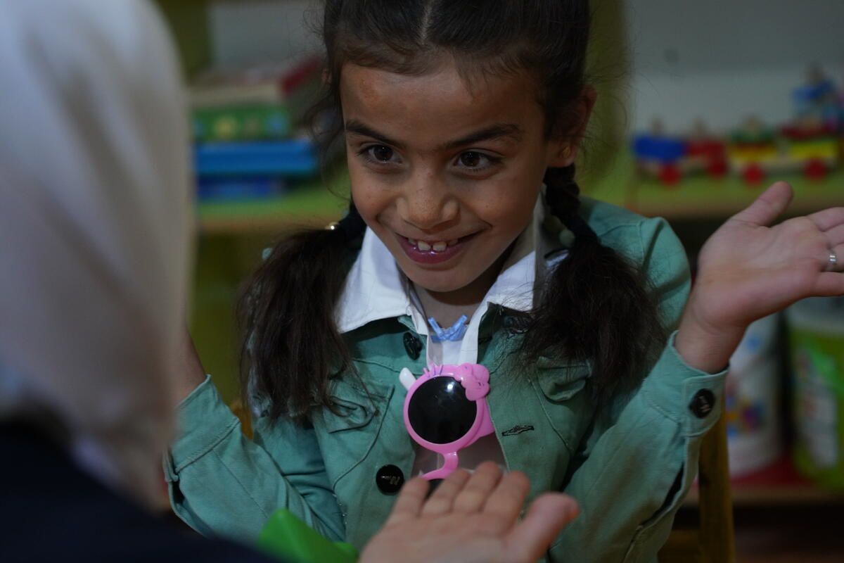 Widad*, 8, attends psychology sessions with Save the Children partners, Sened, in Syria. She has brain atrophy and severe paralysis. The sessions help her overcome the trauma she experienced during the Syria-Türkiye earthquake in February 2023. Image: Khalil Ashawi / Save the Children