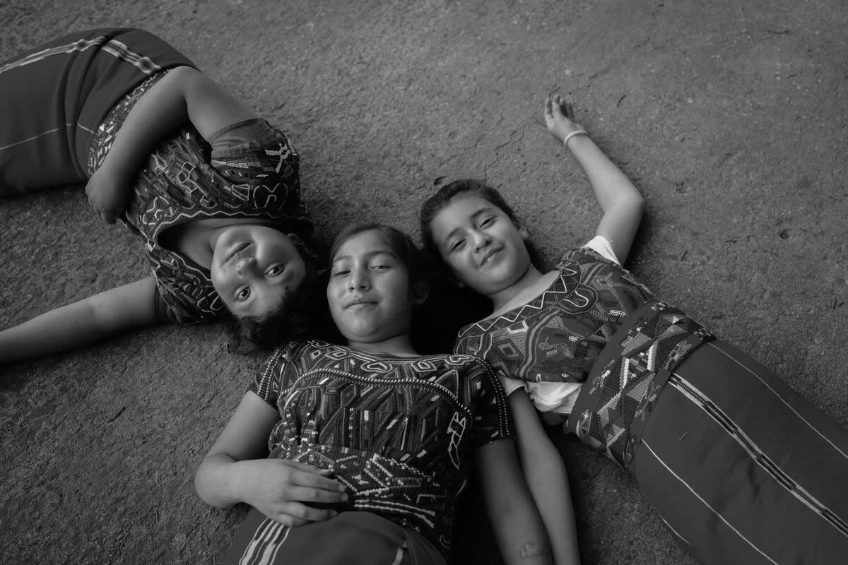 Delmy, 10, Maria Elena, 12, and Anabely, 11, in their school playground in Quiche district, Guatemala where we work with local farmers to develop climate resilient farming practices. The farmers also provide produce to schools for nutritious meals. Luisa Dörr / Save the Children