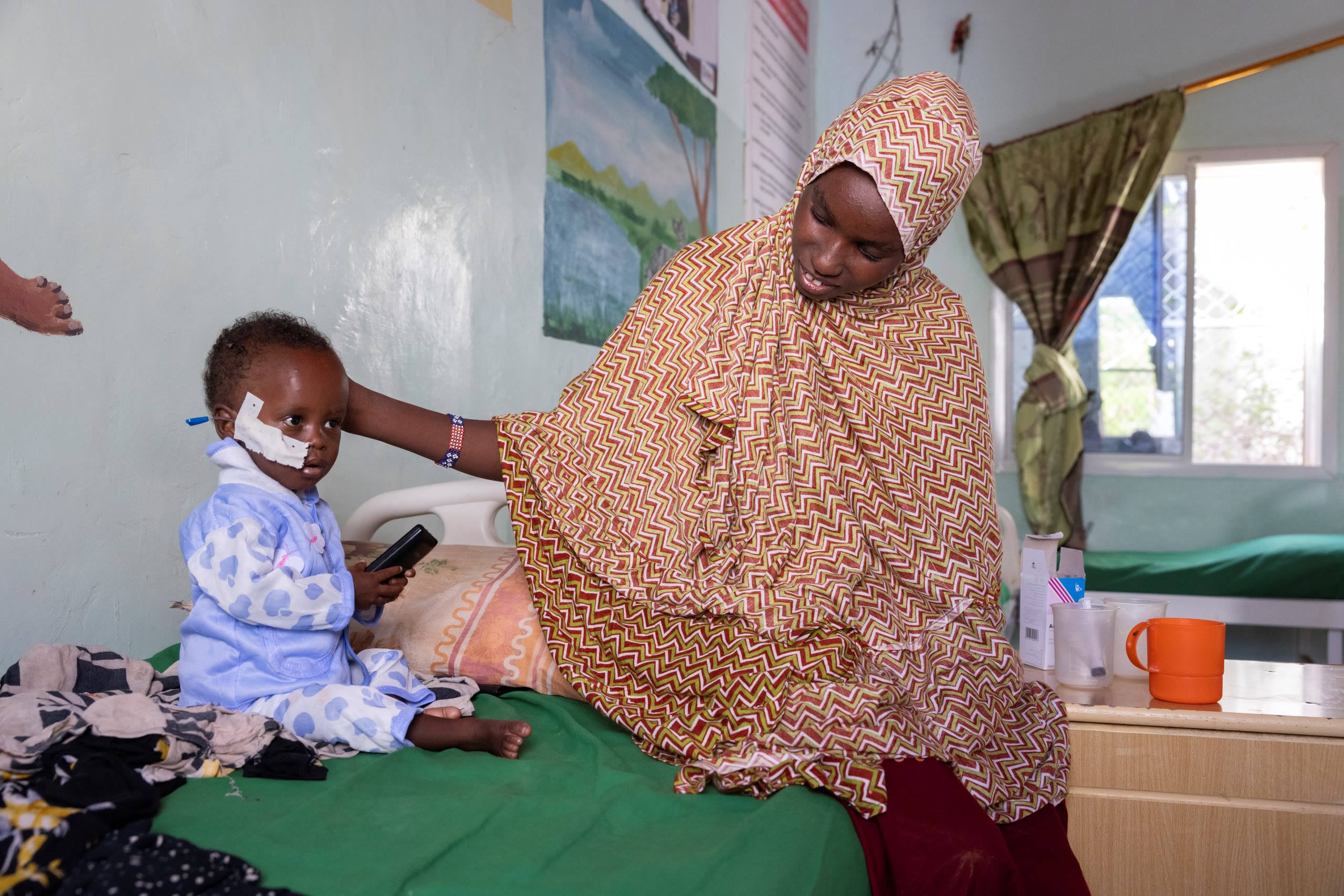 Dalmar*, 15 months old, with his mother Idil* on their third day at the stabilisation centre.