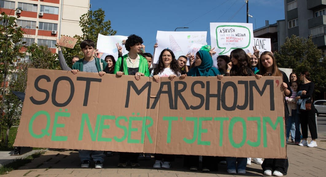 Olt with the Respect Our Rights group march through the streets of Prishtina calling for climate action. Their sign reads “today we march so that tomorrow we can live.” 