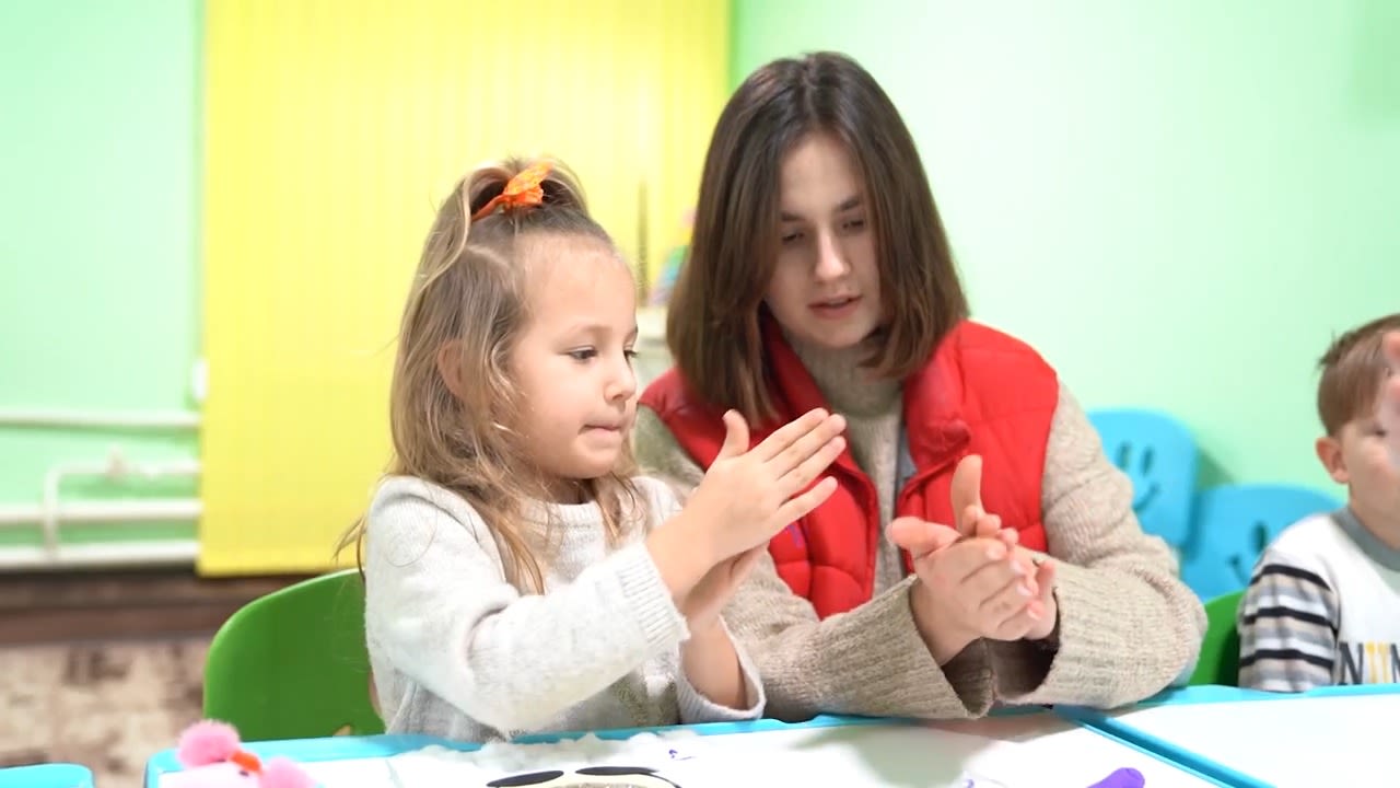 Sofia*, 5, plays with Oleksandra in a Child Friendly Space in Zaporizhzhia, Ukraine