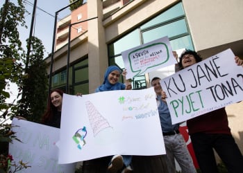 Olt, 16, Loris, Festina and Sara hold up their banners they have made for the climate march they organised in Prishtina, Kosovo