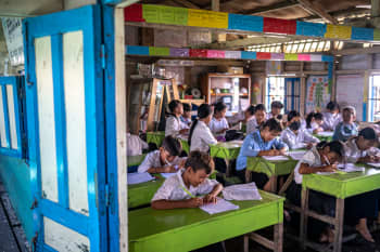 Children learning at a floating school on Tonle Sap Lake, Cambodia