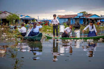 Ratana, 12, and her classmates collect rubbish from Tonle Sap Lake, Cambodia.