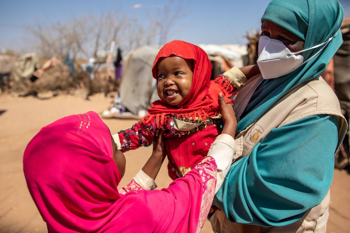 Save the Children’s Family Health Worker Muna holds Suhuur, 2, who she diagnosed and treated for pneumonia.