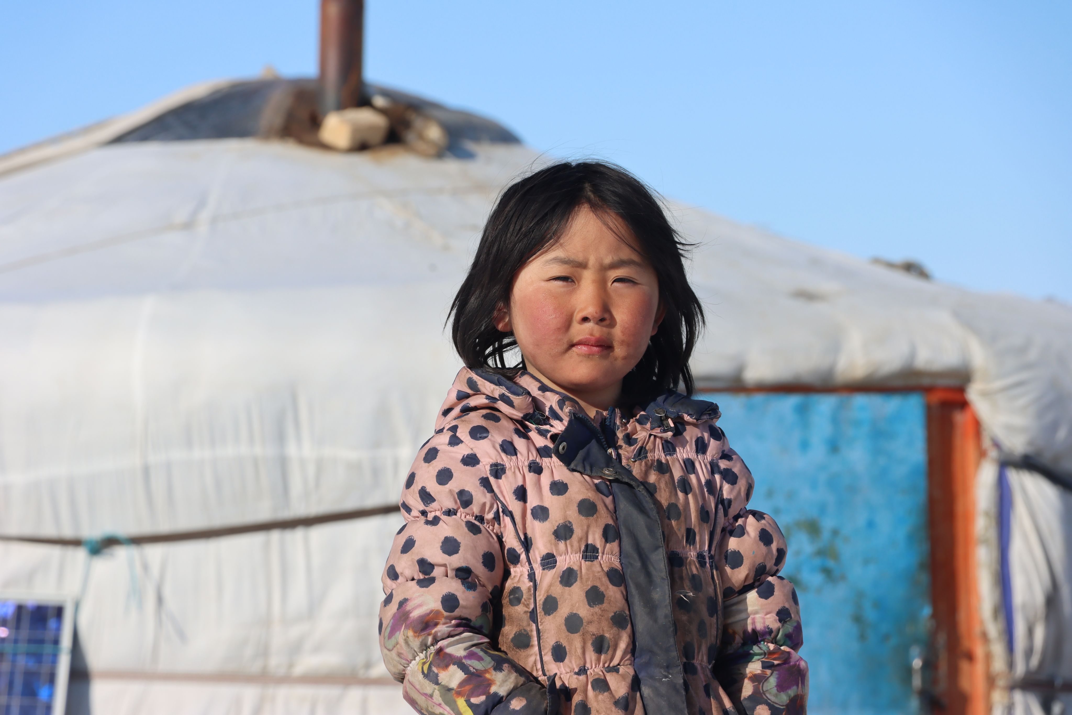 Khongorzul, 6, stands outside of her ger in Sukhbaatar province, Eastern Mongolia