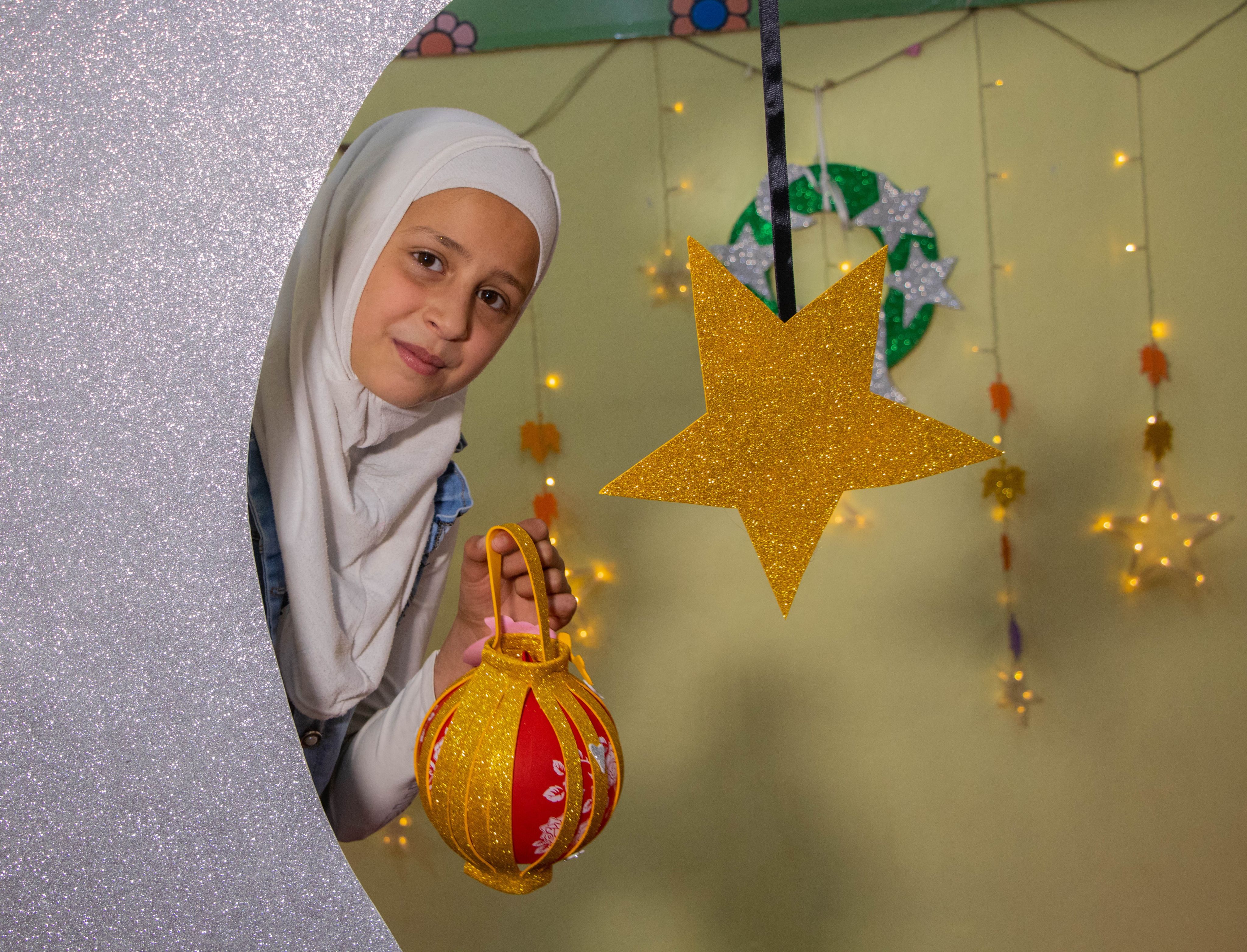  Shurouk*, 10, with her lantern craft project she made in the child friendly space