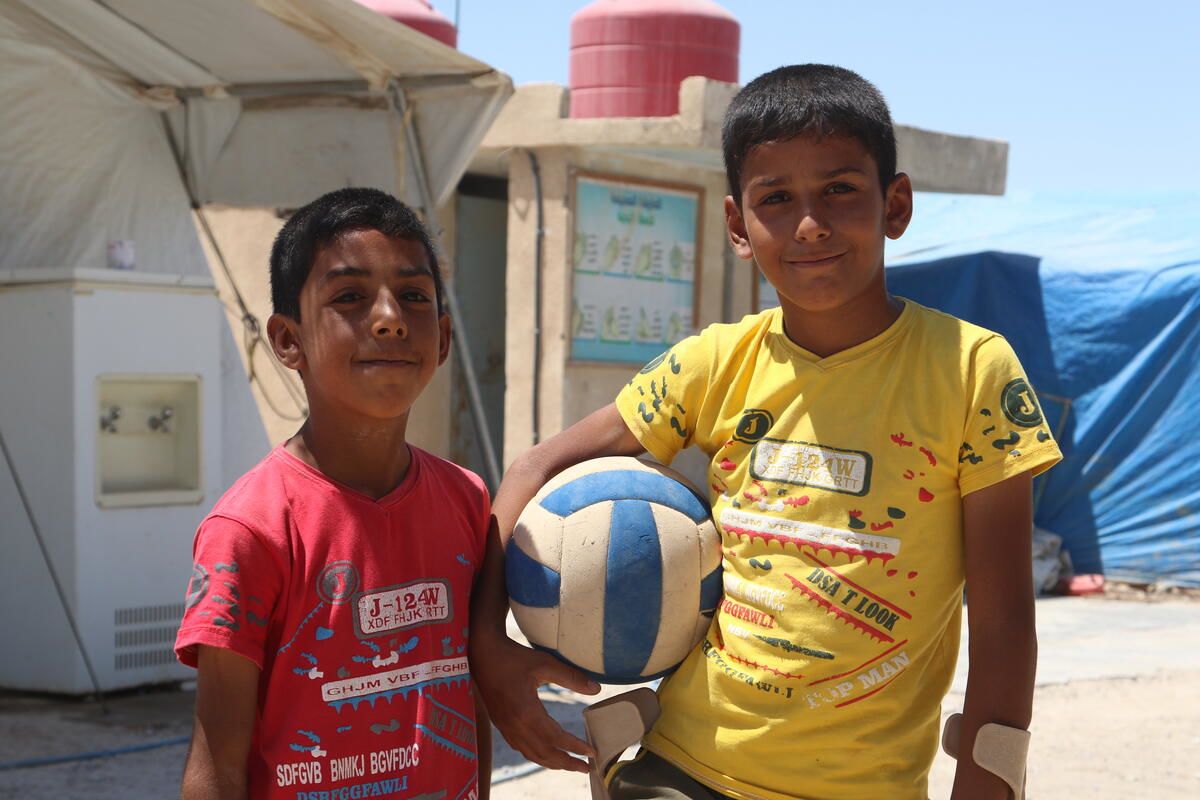 Ammar*, 11, and his 10-year-old brother, Samer*, love playing football at a Child-Friendly Space supported by Save the Children in the displacement camp where they live in North East Syria