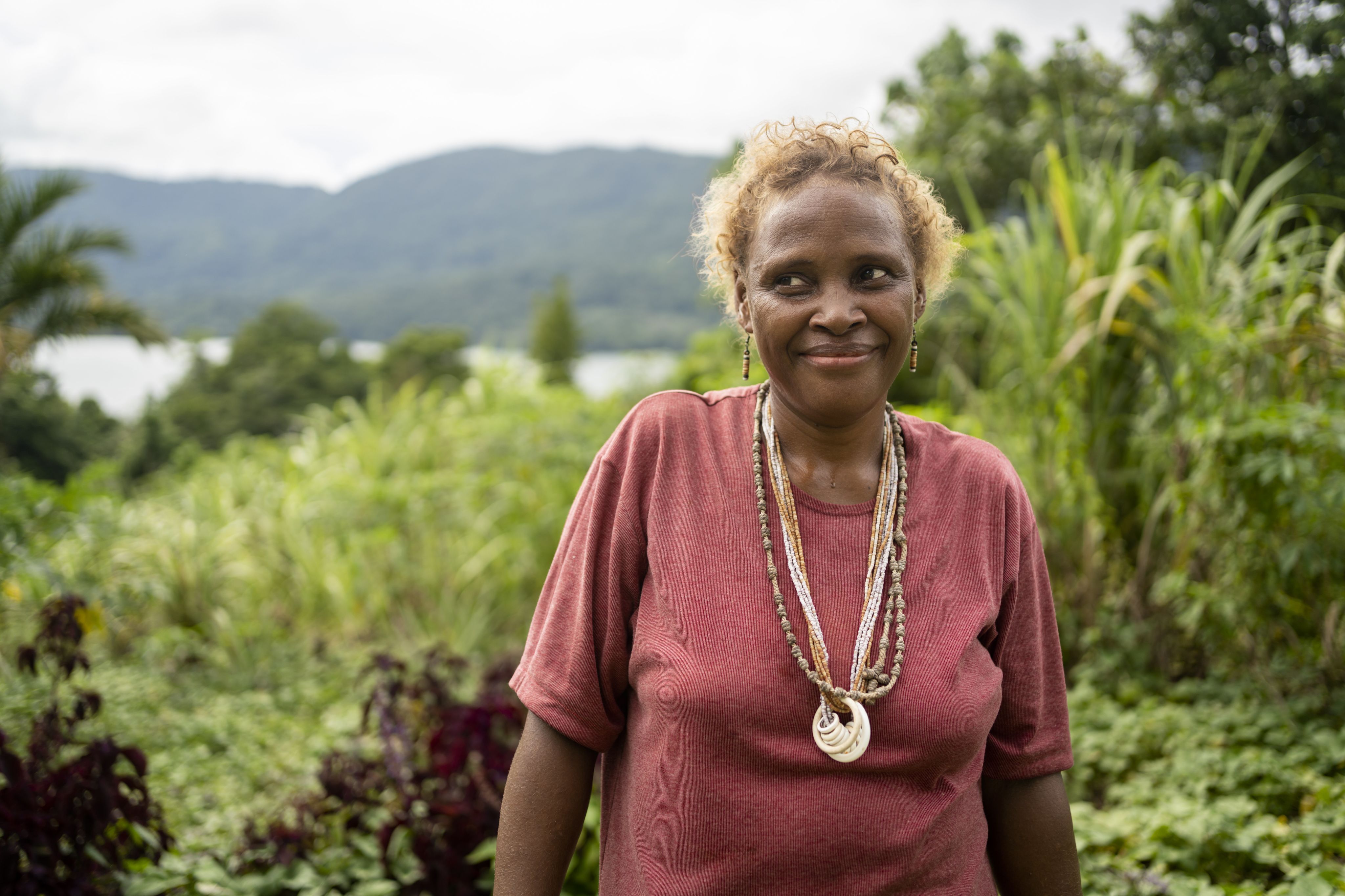 A portrait of Alison, 43, at her family garden in Malaita Province, the Solomon Islands.