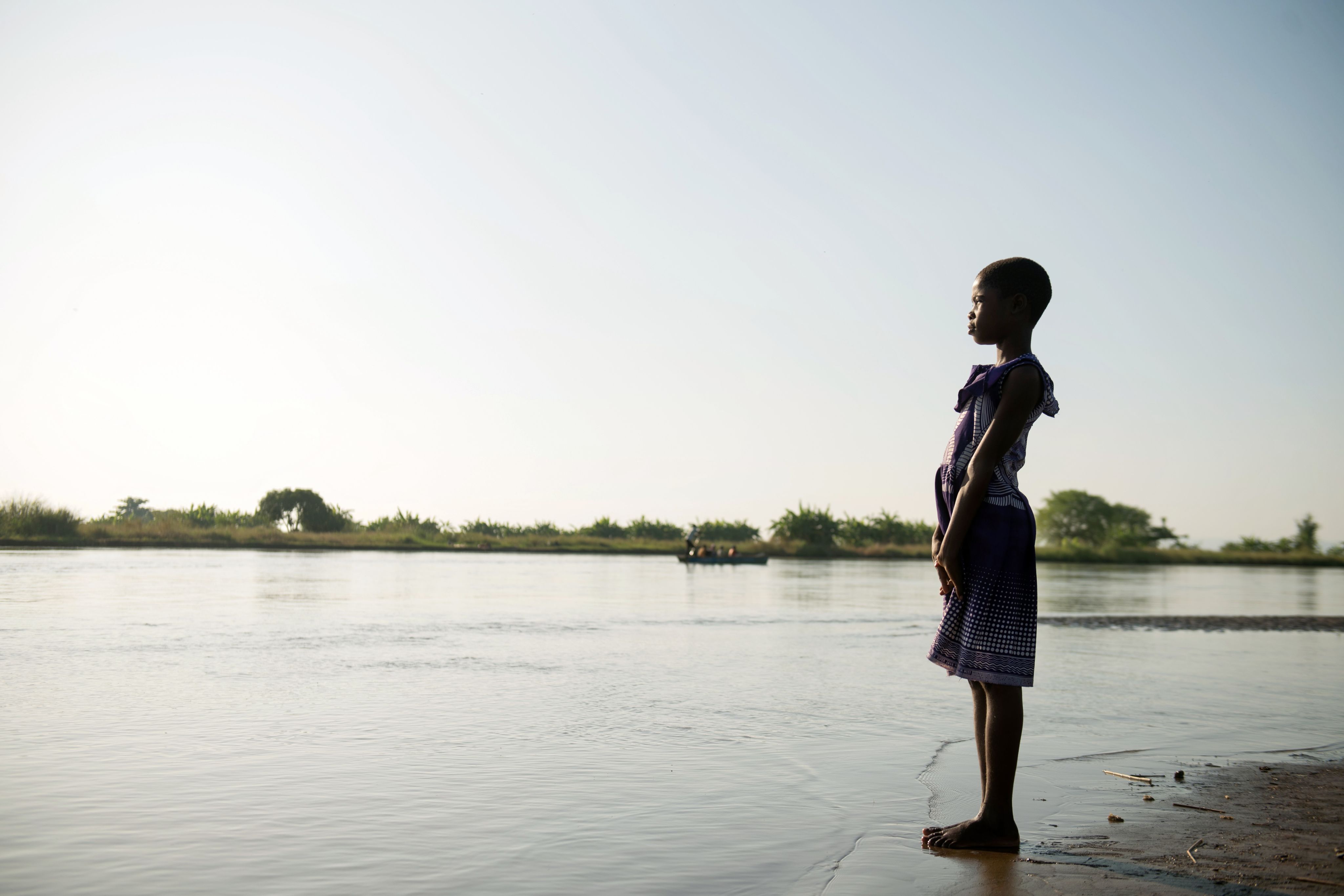 Sarah, 11, looking out over the Shira RIver that flooded her home, Malawi